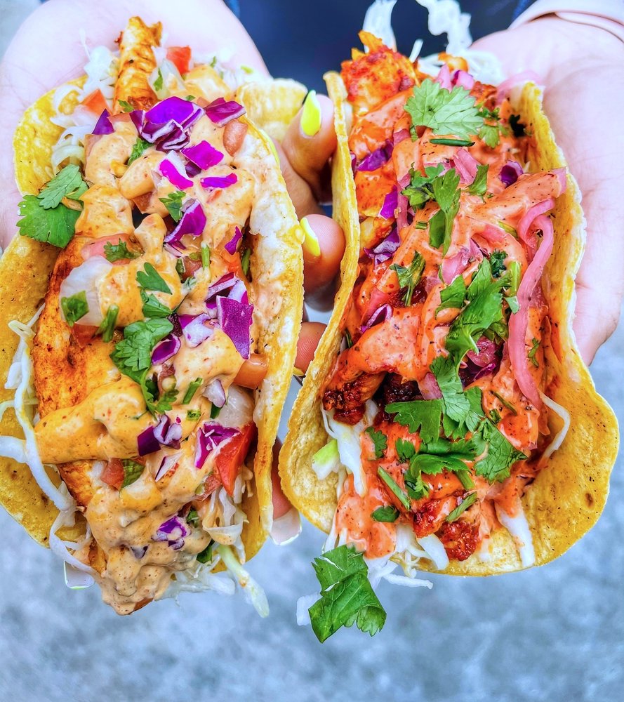 close up of two mouth-watering fish tacos